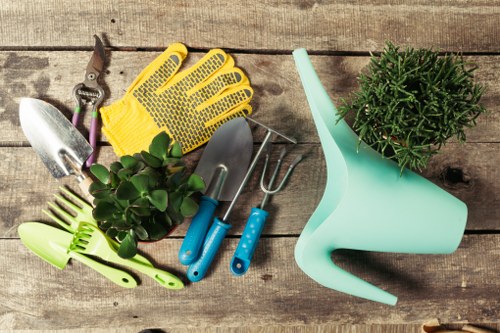 Gardener in Hainault using safety procedures during garden maintenance